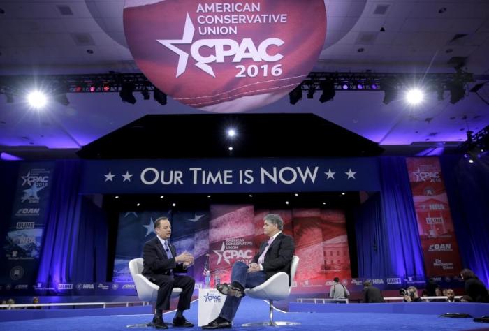 Chairman of the National Republican Committee Reince Priebus (L), speaks with conservative political commentator Sean Hannity at the 2016 Conservative Political Action Conference (CPAC) at National Harbor, Maryland, March 4, 2016.