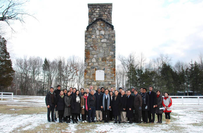 World Evangelical Alliance, World Olivet Assembly leaders gather in front of the monument for the former New York City Mission Society in January 2016.