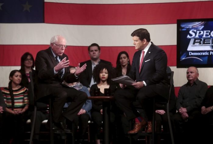 Democratic U.S. presidential candidate Bernie Sanders talks with moderator Bret Baier during a Democratic Presidential Town Hall event in Detroit, Michigan, March 7, 2016.