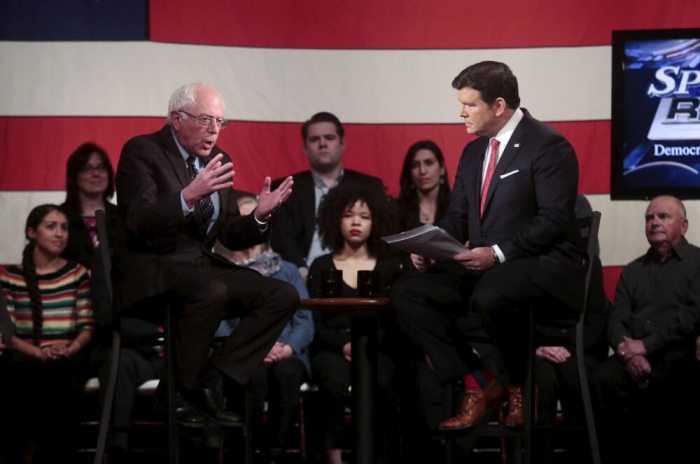 Democratic U.S. presidential candidate Bernie Sanders talks with moderator Bret Baier during a Democratic Town Hall event in Detroit, Michigan, March 7, 2016.