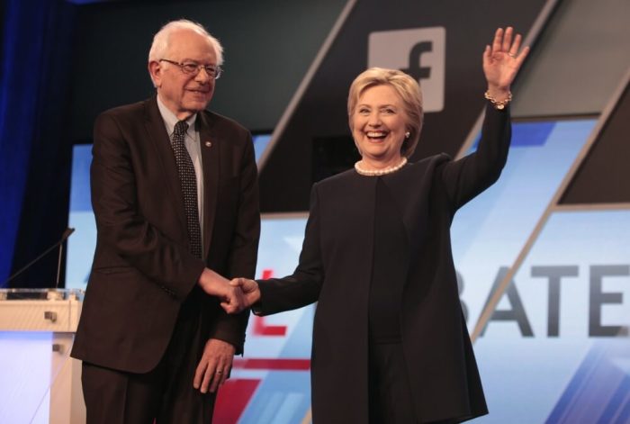 Democratic U.S. presidential candidates Senator Bernie Sanders and Hillary Clinton shake hands before the start of the Univision News and Washington Post Democratic U.S. presidential candidates debate in Kendall, Florida March 9, 2016.