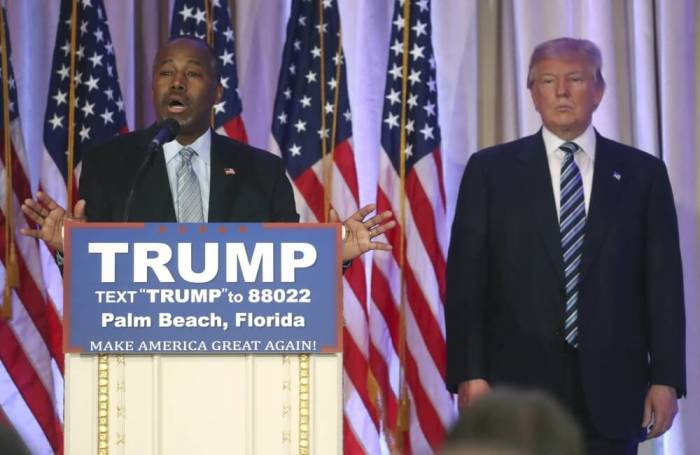 Former Republican U.S. presidential candidate Ben Carson (L) endorses Republican presidential candidate Donald Trump at a Trump campaign event in Palm Beach, Florida March 11, 2016.