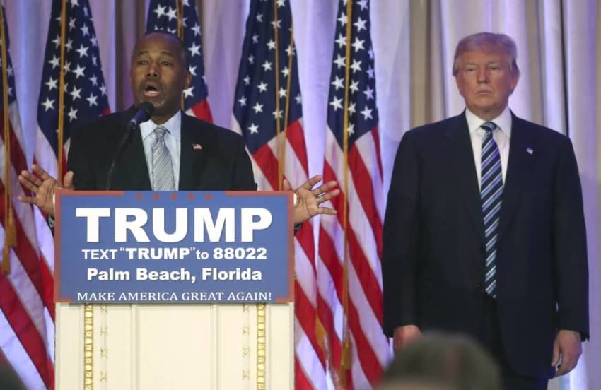 Former Republican U.S. presidential candidate Ben Carson (L) endorses Republican presidential candidate Donald Trump at a Trump campaign event in Palm Beach, Florida March 11, 2016.