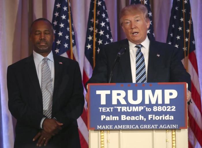 Republican U.S. presidential candidate Donald Trump (R) speaks after receiving the endorsement of former Republican presidential candidate Ben Carson (L) at a campaign event in Palm Beach, Florida March 11, 2016.