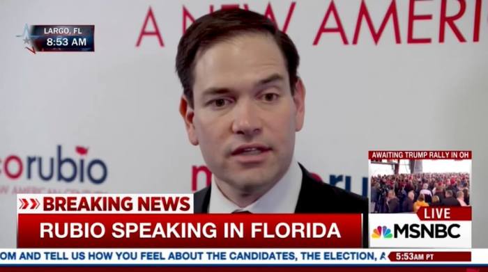 Se. Marco Rubio speaks to reporters before his rally in Florida.