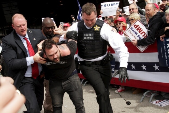 U.S. Secret Service agents detain Thomas DiMassimo after he tried to rush the stage at a Donald Trump rally in Ohio Saturday.