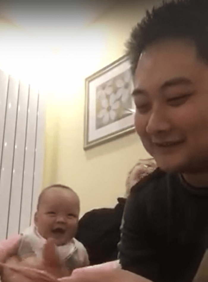 This baby laughs at the counting of money.