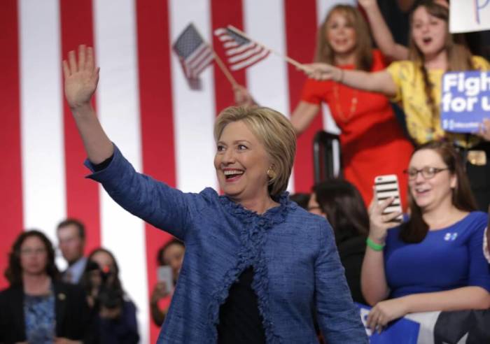 Democratic U.S. presidential candidate Hillary Clinton waves as she arrives to speak to supporters at a campaign rally in West Palm Beach, Florida, March 15, 2016.