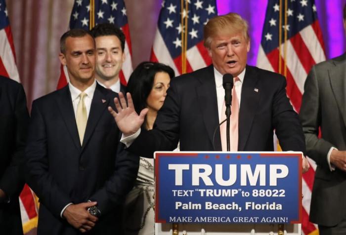 Republican U.S. presidential candidate Donald Trump speaks with his campaign manager Corey Lewandowski (L) at his side as he talks about the results of the Florida, Ohio, North Carolina, Illinois and Missouri primary elections during a news conference held at his Mar-A-Lago Club, in Palm Beach, Florida, March 15, 2016.