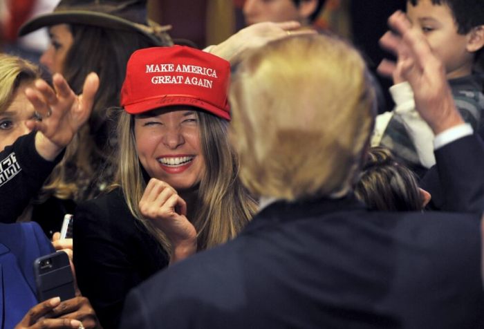 A woman smiles after getting an autograph by Republican presidential candidate and businessman Donald Trump on her hat after he spoke at a campaign rally South Point Resort and Casino in Las Vegas, Nevada, January 21, 2016.