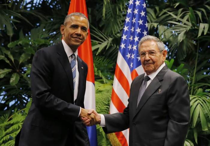 U.S. President Barack Obama and Cuba's President Raul Castro shake hands during their first meeting on the second day of Obama's visit to Cuba, in Havana March 21, 2016.