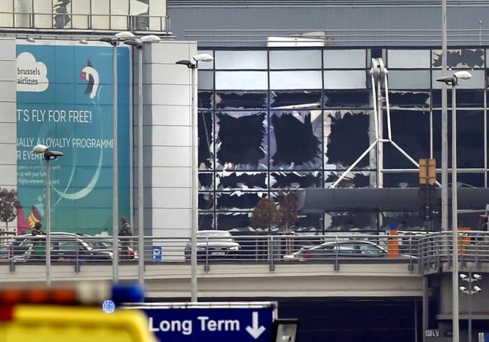 Broken windows seen at the scene of explosions at Zaventem airport near Brussels, Belgium, March 22, 2016.