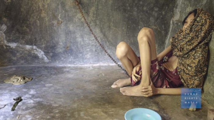 A mentally ill woman is chained up and locked away as a victim of the practice of pasung in Indonesia in this undated photo.
