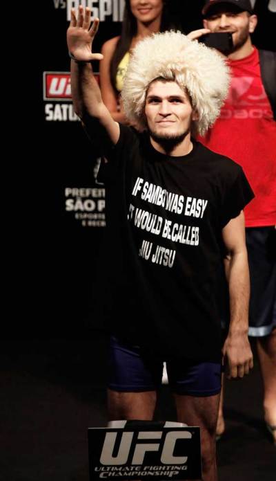 UFC (Ultimate Fighting Championship) fighter Khabib Nurmagomedov of the U.S. gestures after an official weigh-in in Sao Paulo January 18, 2013. Nurmagomedov will face Thiago Tavares of Brazil on Saturday.