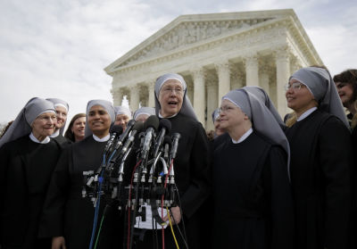 Sister Loraine McGuire with Little Sisters of the Poor speaks to the media after Zubik v. Burwell, an appeal brought by Christian groups demanding full exemption from the requirement to provide insurance covering contraception under the Affordable Care Act, was heard by the U.S. Supreme Court in Washington March 23, 2016.