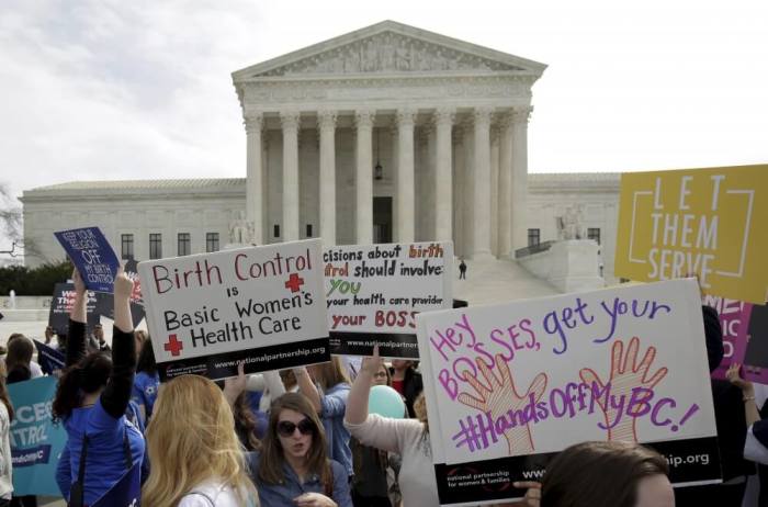 Supporters of contraception rally before Zubik v. Burwell, an appeal brought by Christian groups demanding full exemption from the requirement to provide insurance covering contraception under the Affordable Care Act, is heard by the U.S. Supreme Court in Washington March 23, 2016.