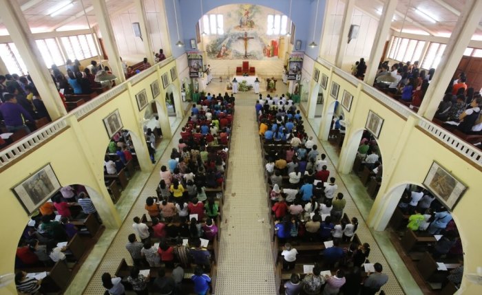 Christians attend Sunday Mass to celebrate Malaysia Day at a church in Tambunan, Malaysia, September 16, 2012.