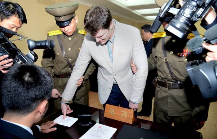 U.S. student Otto Warmbier has his fingerprints taken at North Korea's top court, in this photo released by North Korea's Korean Central News Agency in Pyongyang on March 16, 2016. North Korea's supreme court sentenced Warmbier, a 21-year-old University of Virginia student, who was arrested while visiting the country, to 15 years of hard labor on Wednesday for crimes against the state.