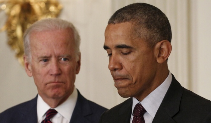 U.S. Vice President Joe Biden looks toward President Barack Obama during the Easter Prayer Breakfast at the White House in Washington March 30, 2016.