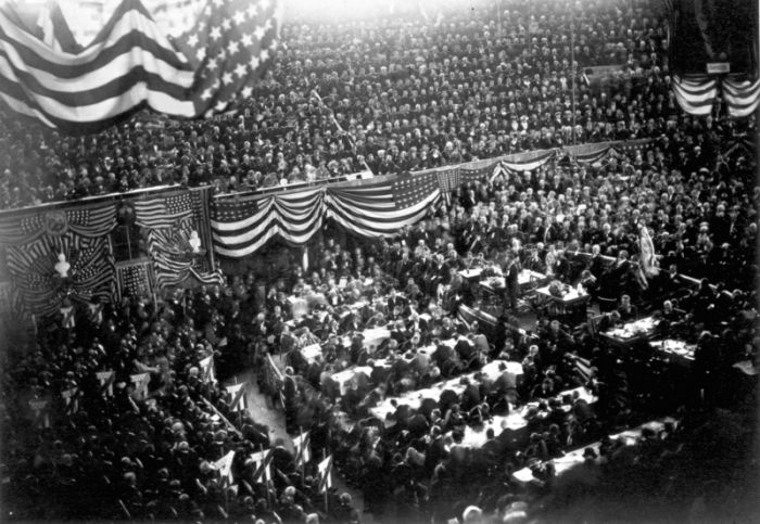 1880 Republican National Convention at Chicago, Illinois. A view inside the Interstate Exposition Building (known as the 'Glass Palace') during the convention; James Garfield (center, right) is on the podium, waiting to speak.