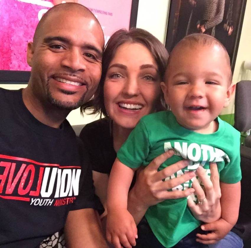 Pastor Joseph Sissac (L), his wife Victoria and son.