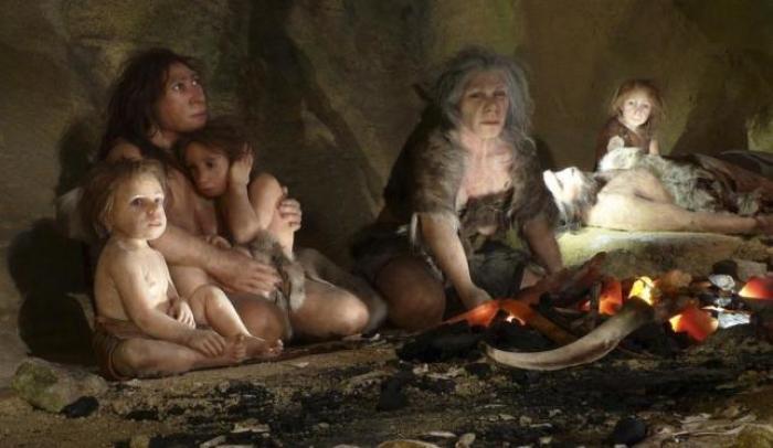 The picture above showcases the typical life of a Neanderthal family in a cave.