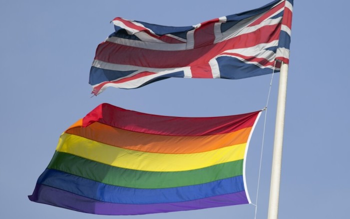 A rainbow flag flies with the Union flag above British Cabinet Offices, marking the first day Britain has allowed same-sex marriages, in London March 29, 2014.