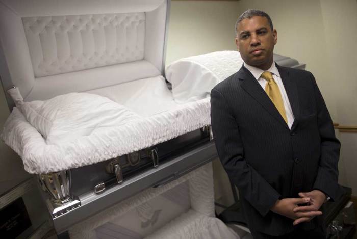 Spencer Leak, Jr., Vice President and licensed Funeral Director at Leak & Sons Funeral Homes, poses for a photograph in the display room in Country Club Hills, Illinois, April 20, 2015. Funeral directors are lobbying lawmakers to reverse million in cuts for burial services for the poor, which they say could result in unclaimed bodies at morgues, hospitals and nursing homes.