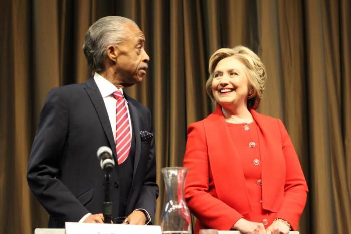 Democratic presidential frontrunner Hillary Clinton (R) stands with civil rights leader Rev. Al Sharpton (L)prior to her address at the National Action Network's convention in New York City on Wednesday April 13, 2016.