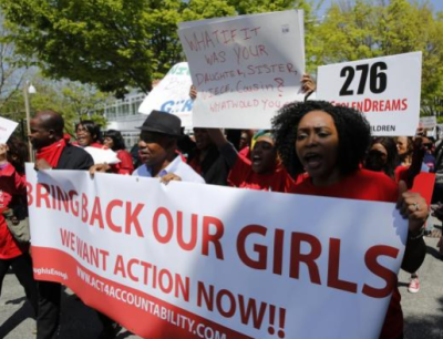 Protesters march in support of the girls kidnapped by members of Boko Haram in front of the Nigerian Embassy in Washington May 9, 2014