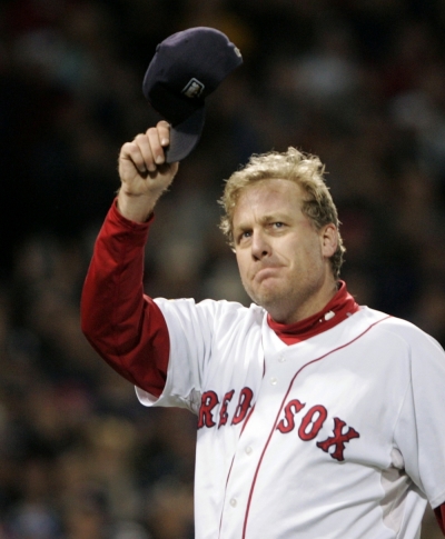 Boston Red Sox pitcher Curt Schilling tips his cap to the fans as he is taken out of a game during the sixth inning against the Colorado Rockies in Game 2 of Major League Baseball's World Series in Boston, in this file image taken October 25, 2007. Schilling announced his retirement March 23, 2009 after six All-Star appearances, three World Series championships and a reputation as one of baseball's big-game performers.