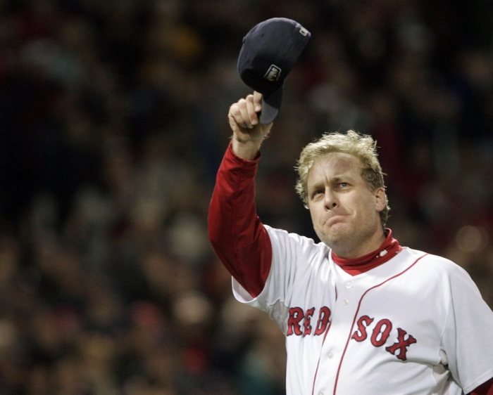 Boston Red Sox pitcher Curt Schilling tips his cap to fans as he is taken out of the game in the sixth inning against the Colorado Rockies in Game 2 of Major League Baseball's World Series in Boston, October 25, 2007.