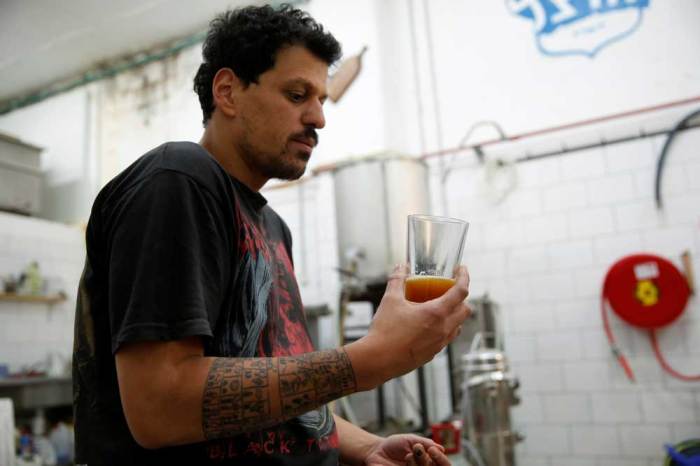 Itai Gutman, owner of Herzl Brewery which produced a craft beer from wheat that Tel Aviv University geneticists identified as the strain used for beer in the Holy Land two millennia ago, works at the brewery in Jerusalem April 18, 2016.