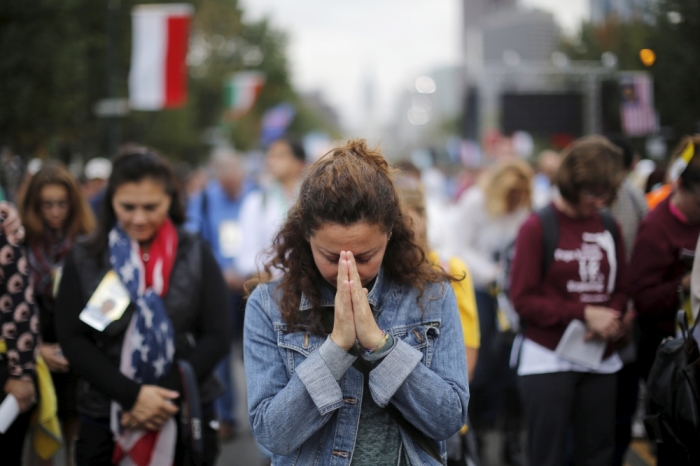 A woman prays 