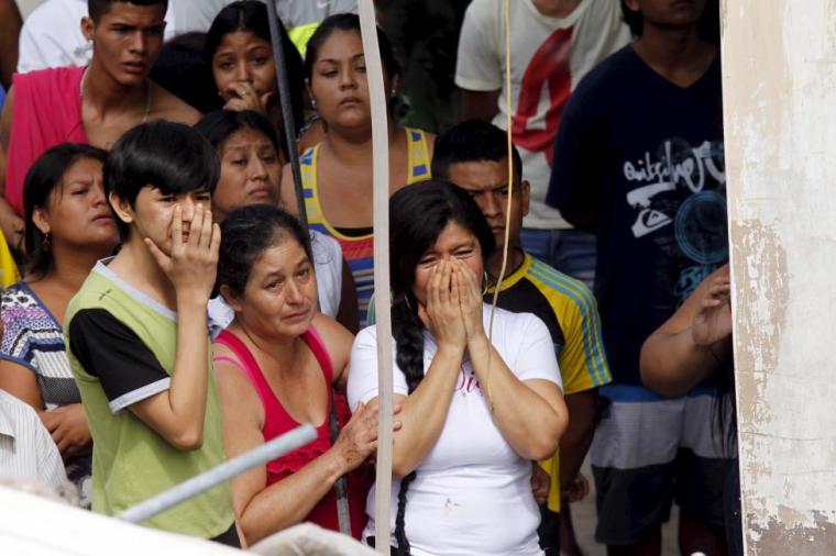 People react after an earthquake struck off Ecuador's Pacific coast, at Tarqui neighborhood in Manta on Sunday, April 17, 2016.