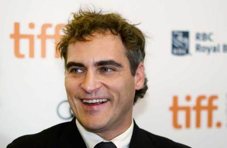 Actor Joaquin Phoenix arrives on the red carpet for the gala presentation of the film "The Master" at the 37th Toronto International Film Festival, September 7, 2012.