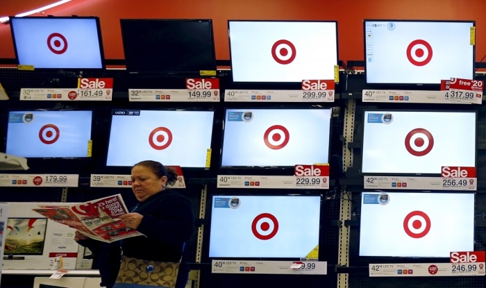 A shopper looks at a sales flier during Black Friday Shopping at a Target store in Chicago, Illinois, United States, November 27, 2015.