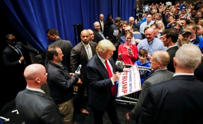 U.S. Republican presidential candidate Donald Trump signs autographs after speaking during a campaign rally at the Century Center in South Bend, Indiana, U.S., May 2, 2016.
