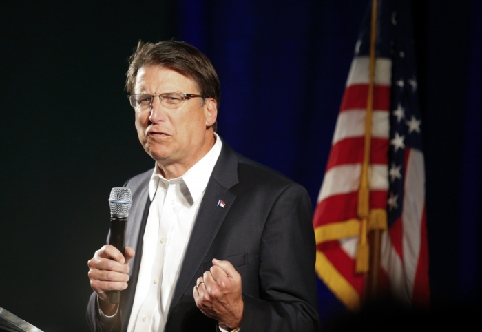 Governor of North Carolina Pat McCrory introduces candidate for U.S. Senate Thom Tillis (R-NC) at a campaign stop in Raleigh, North Carolina October 29, 2014.