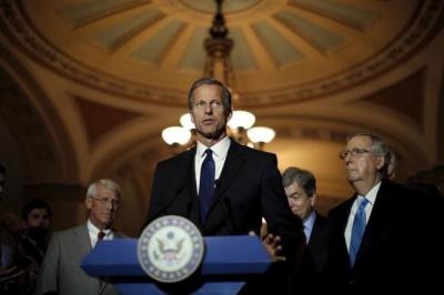 Senator John Thune (R-SD) speaks during a news conference accompanied by (L-R) Senator Roger Wicker, Roy Blunt (R-MO) and Senate Majority Leader Senator Mitch McConnell (R-KY) following party policy lunch meeting at the U.S. Capitol in Washington August 4, 2015.