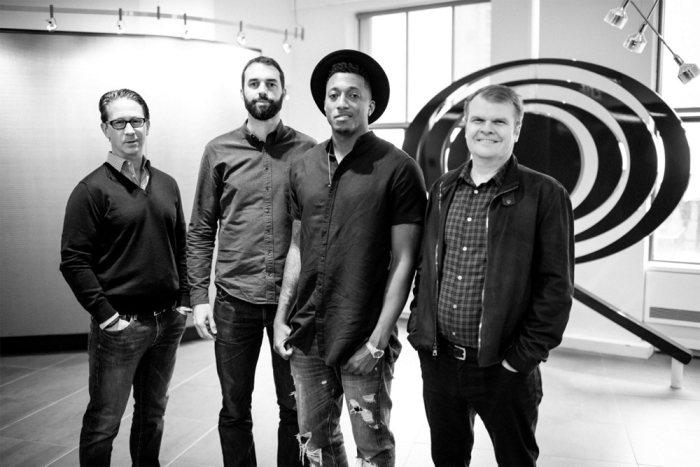 From Left: Joel Klaiman, executive vice president and general manager of Columbia Records; Ben Washer co-owner and CEO of Reach Records; Lecrae, and Rob Stringer, chairman and CEO of Columbia Records.