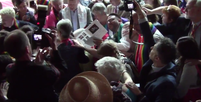 A group of LGBT-affirming United Methodist Church clergy and church members hold an unofficial ordination for lesbian activist Sue Laurie at the United Methodist Church's 2016 General Conference in Portland, Oregon, on May 10, 2016.
