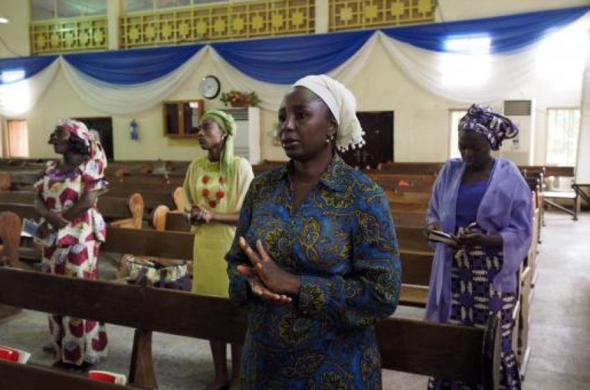 Churchgoers sing at an Evangelical Church of West Africa (ECWA) church in Abuja May 11, 2014