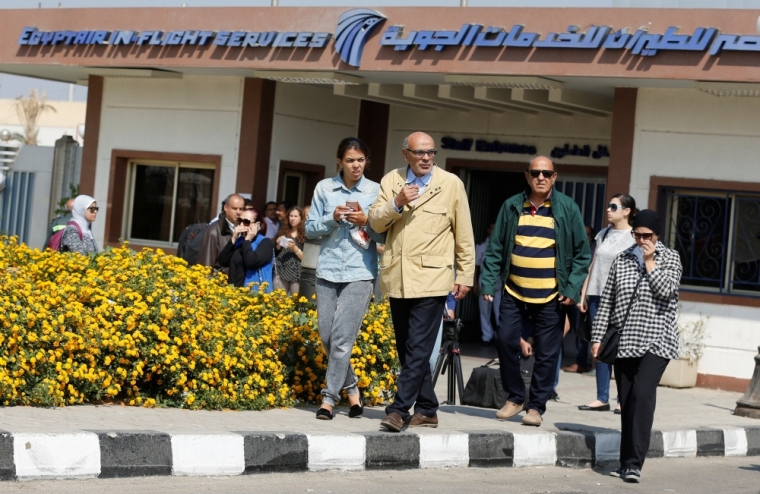 Unidentified relatives and friends of passengers react as they wait outside the Egyptair in-flight service building where relatives are being held at Cairo International Airport, Egypt, May 19, 2016.