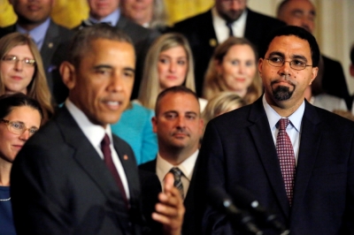 Secretary of Education John B. King listens as U.S. President Barack Obama delivers remarks during a ceremony presenting the 2016 National Teacher of the Year at the White House in Washington, U.S., May 3, 2016.
