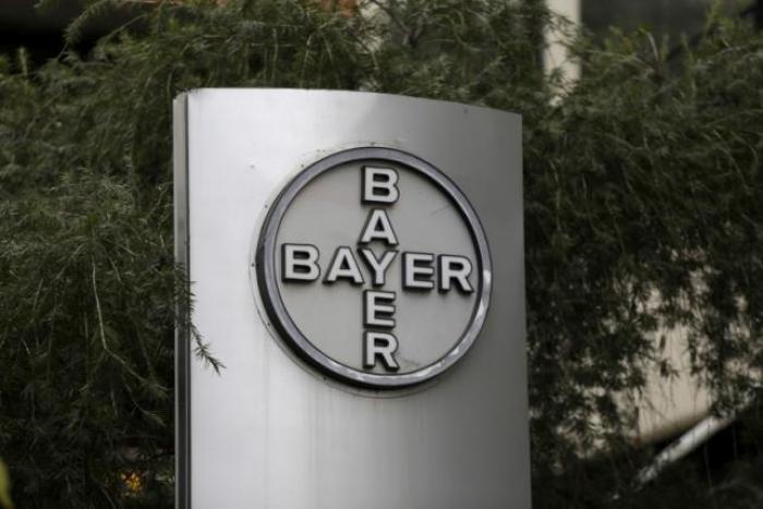 The corporate logo of Bayer is seen at the headquarters building in Caracas March 1, 2016. Picture taken March 1, 2016.