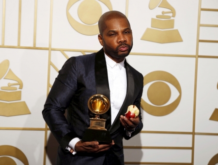 Kirk Franklin poses with the award for Best Gospel Performance/Song for "Wanna Be Happy?" during the 58th Grammy Awards in Los Angeles, California, February 15, 2016.