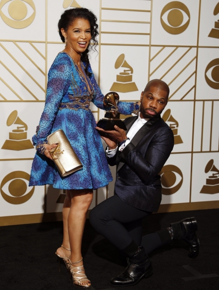 Kirk Franklin poses with his wife Tammy with the award for Best Gospel Performance/Song for "Wanna Be Happy?" during the 58th Grammy Awards in Los Angeles, California, February 15, 2016.