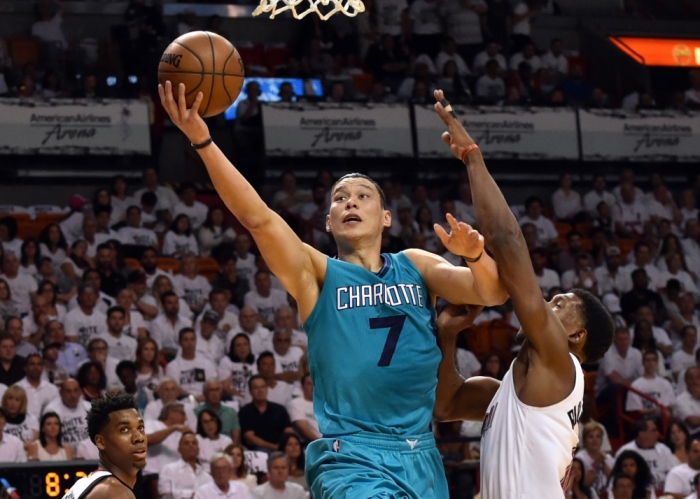 Charlotte Hornets guard Jeremy Lin (7) drives to the basket as Miami Heat guard Josh Richardson (0) defends during the first half in game one of the first round of the NBA Playoffs at American Airlines Arena, Miami, Florida, April 17, 2016.