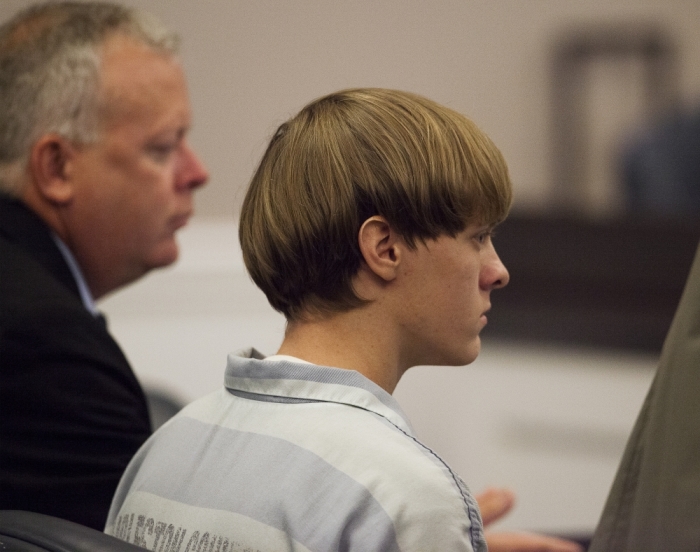 Dylann Roof (R), the 21-year-old man charged with murdering nine worshippers at a historic black church in Charleston last month, listens to the proceedings with assistant defense attorney William Maguire during a hearing at the Judicial Center in Charleston, South Carolina, July 16, 2015.
